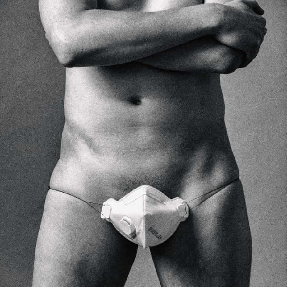 A male model poses wearing a face mask over his genitalia for a Guardian Weekend story about sex during Covid, 26 May
