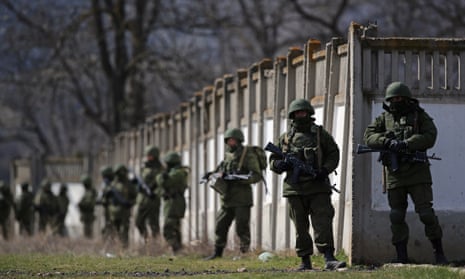 Russian military personnel surround a Ukrainian military base in Perevalnoe in March 2014