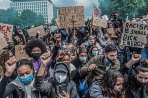 Protesters at a Black Lives Matter rally in Brussels carry signs denouncing Belgium’s imperial exploitation of what is now DRC.