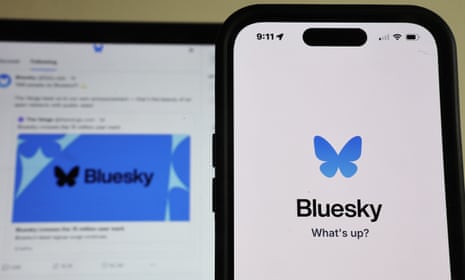 The Bluesky logo on a phone screen and a laptop screen