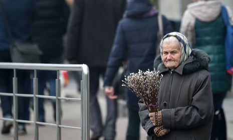 An elderly woman sells willow twigs in Kyiv in January 2020