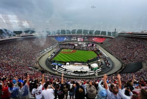 A flyover is performed during the national anthem prior to the MLB Speedway Classic.