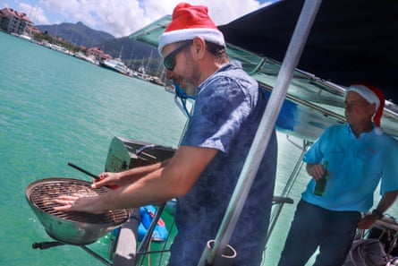 Lighting the BBQ at Steel Sapphire at Christmas 2000 in the Seychelles.