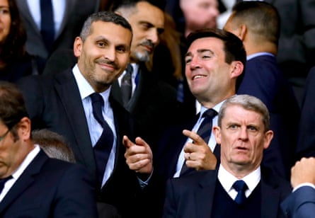 Andy Burnham and Manchester City chairman Khaldoon al-Mubarak sit smiling in a crowd