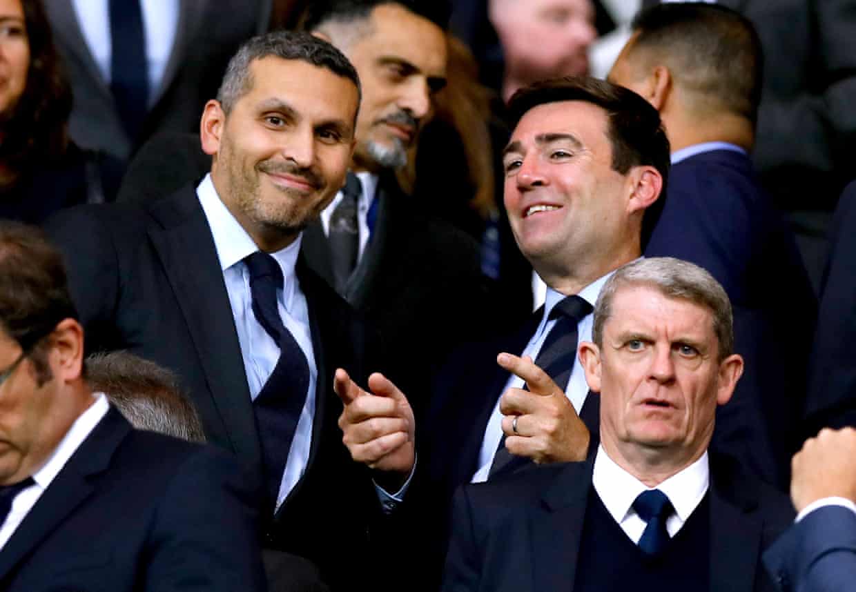 Andy Burnham and Manchester City chairman Khaldoon al-Mubarak sit smiling in a crowd
