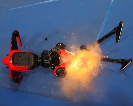 A humanoid lying on the floor on fire