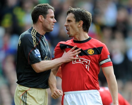 Jamie Carragher argues with Gary Neville on the football field