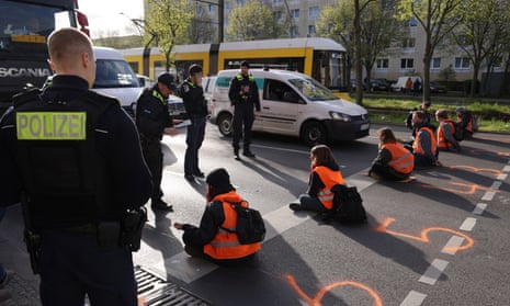 Letzte Generation activists block traffic on a road in Berlin