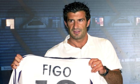 Luis Figo shows off his Real Madrid shirt in July 2000