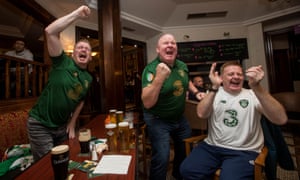 Ireland fans Andy Whelan, Patrick Hegarty and Alan Condron celebrate Shane Duffy scoring their equaliser.