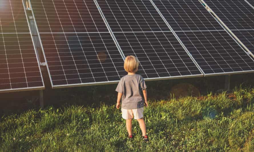 Boy looking at solar panels