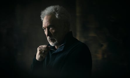 Tom Jones poses thoughtfully in a three-quarter light that leaves the nearest side of his face in shadow