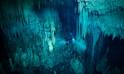 Exploring underwater caves in the Mexican jungle.