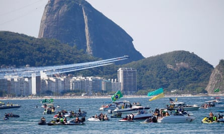Bolsonaro supporters watch aerobatic display from their boats during a campaign rally at Copacabana in Rio de Janeiro, Brazil.