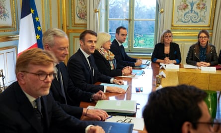 Emmanuel Macron (centre) attends the first meeting of his new cabinet