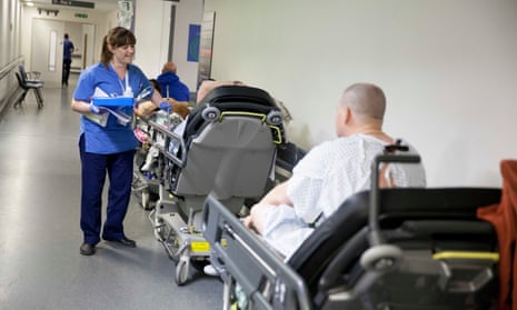 A nurse attends to patients waiting for spaces in A&E
