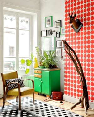 Joining the dots: vintage cabinet, home-made lamp and Marimekko wallpaper in the living room.