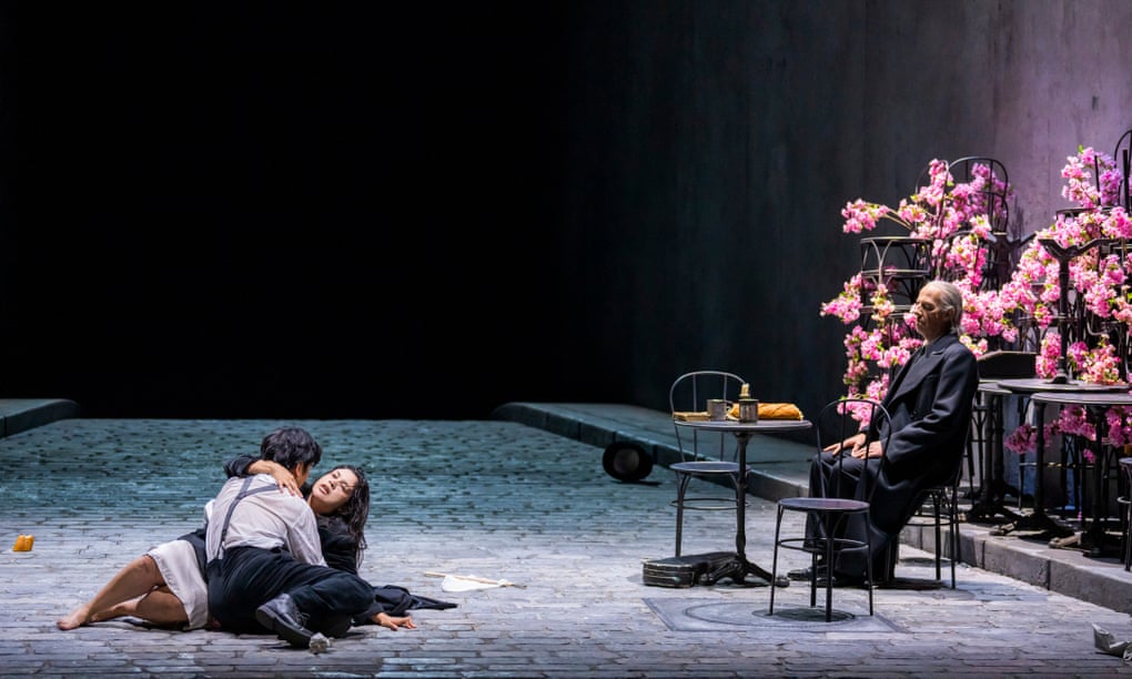 Sehoon Moon (Rodolfo), Yaritza Véliz (Mimì) and Christopher Lemmings (Death) in La Bohème at the Glyndebourne festival. 