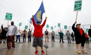 United Auto Workers (UAW) members picket at a gate at the General Motors Flint Assembly Plant on Monday.