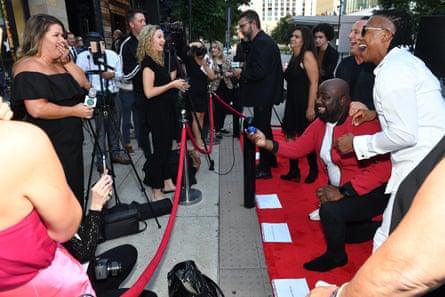 Newsboys’ Michael Tait and Duncan Phillips assist in a marriage proposal between Otto Price and Sami Cone during red carpet arrivals for the premiere of Lionsgate’s “The Jesus Music” at the Country Music Hall of Fame and Museum in Nashville, Tennessee, on 27 September 2021.