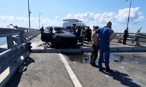 Russian investigators on the Crimea bridge on Monday after the blasts