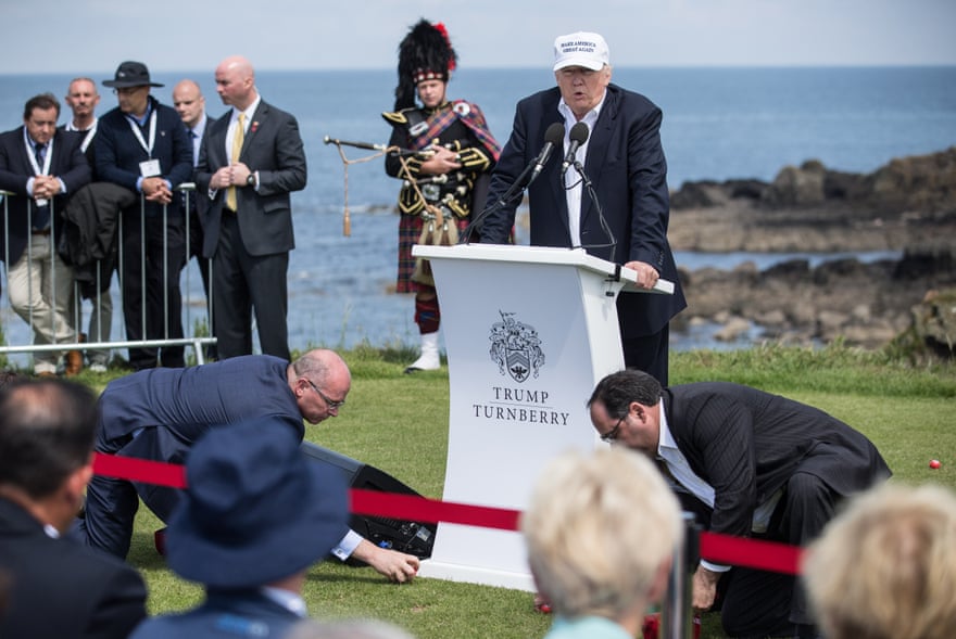 Fore! … Donald Trump’s aides clear away the swastika golfballs spread by Brodkin at Turnberry golf course in 2016.