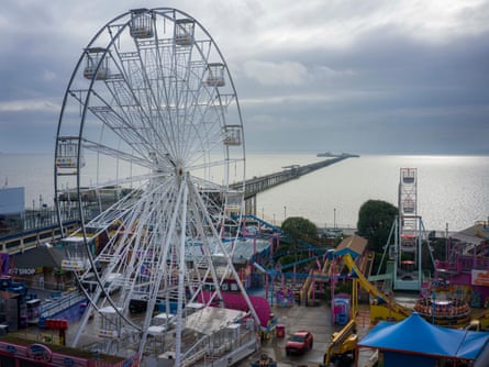 View of Southend pier with a ferris wheel in the foreground