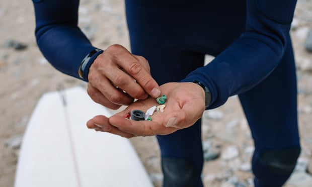 Surfers Against Sewage collect pieces of plastic pollution at Porthtowan Beach, Cornwall.