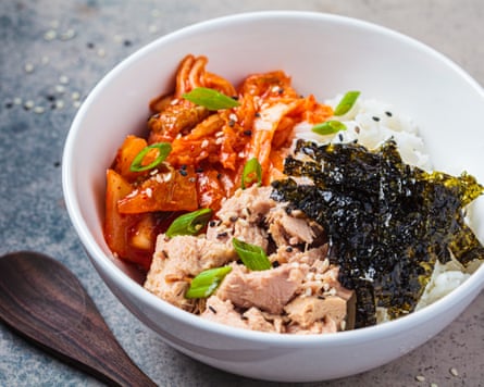 a white bowl with rice, tuna and kimchi