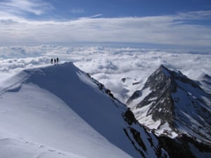 The summit of the Weismiess, a mountain above Saas Fee, on the border of Switzerland and Italy; Italy is in the clouds below.