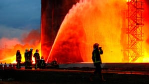 Firefighters battle a massive blaze in Lviv on Sunday in a fuel storage facility hit on Saturday by Russian cruise missiles as thick smoke and flames were seen rising from the fuel depot.