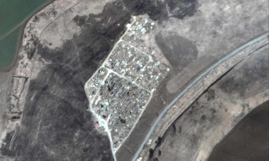 Russia-Ukraine war latest: Zelenskiy warns Moscow wants to ‘capture other countries’ as Russia pushes to seize southern Ukraine– live | Ukraine 8 This satellite image released by Maxar Technologies on Friday shows a cemetery near Vynohradne on March 22.