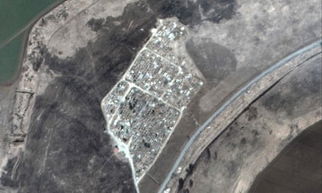 This satellite image released by Maxar Technologies on Friday shows a cemetery near Vynohradne on March 22.