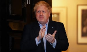 Prime Minister Boris Johnson clapping outside 11 Downing Street in London to salute local heroes during Thursday’s nationwide Clap for Carers NHS initiative.