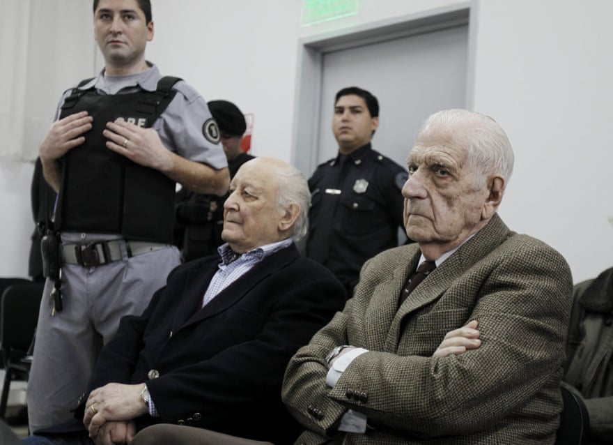 Former Argentinian junta president Reynaldo Bignone (right) and former general Santiago Riveros (centre) at their trial for crimes against humanity in 2012.