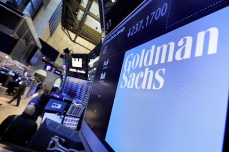 The logo for Goldman Sachs appears above a trading post on the floor of the New York Stock Exchange.