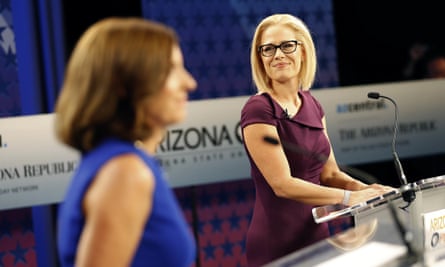 Martha McSally, left, who is running against Krysten Sinema, said she is getting her ‘ass kicked’ over her votes to scrap Obamacare.
