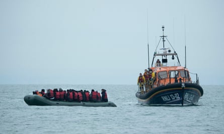 An RNLI lifeboat rescues people from a small boat in the Channel on 24 November 2021