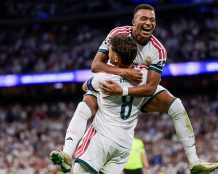 Real Madrid’s Fede Valverde celebrates with teammate Kylian Mbappé after scoring.