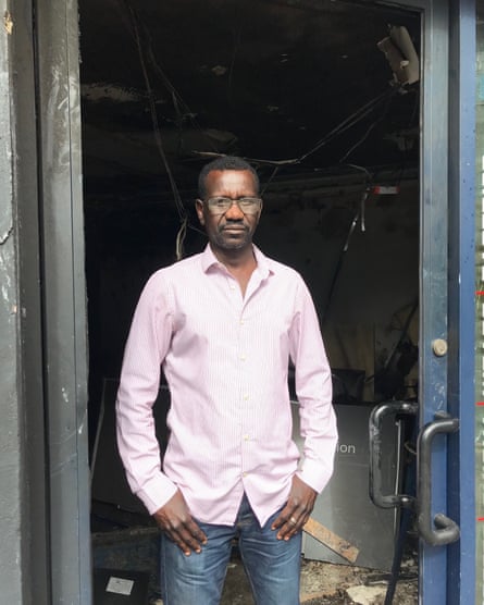 Mohammed Idris outside his burnt-out cafe in Belfast