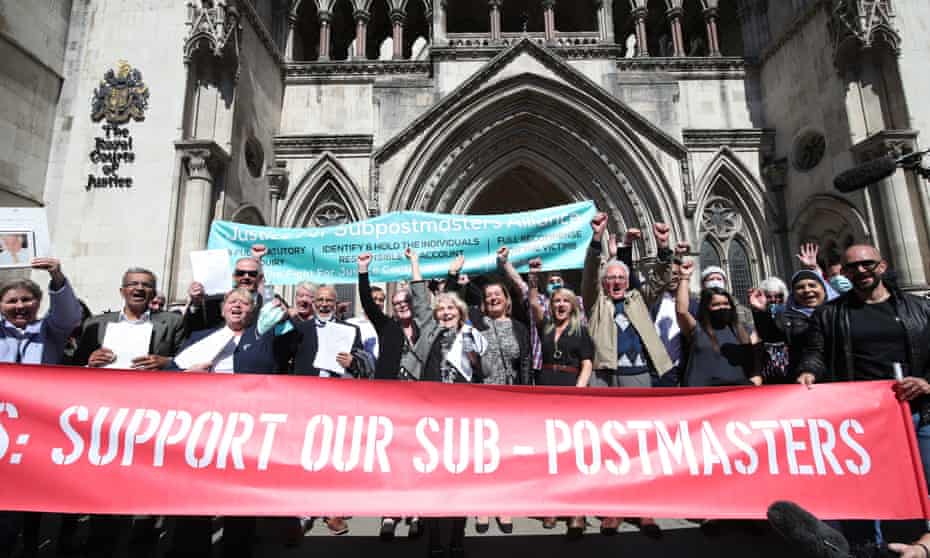 Former post office workers celebrating outside the Royal Courts of Justice, London, after their convictions were overturned by the court of appeal.