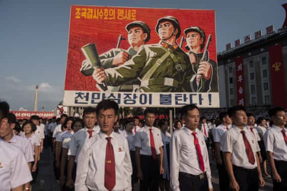 A propaganda poster is diplsyed during a rally in support of North Korea's stance against the US, on Kim Il-Sung square in Pyongyang. 