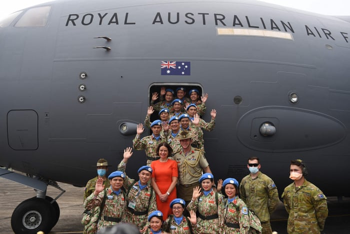 Vietnamese forces taking part in a UN peacekeeping mission in South Sudan with Australian ambassador to Vietnam Robyn Mudie in front of a Royal Australian Air Force aircraft.