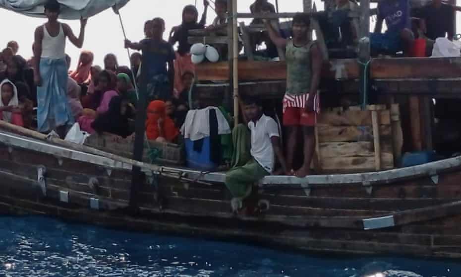 Rohingya refugees stranded on a wooden boat off Aceh province, Indonesia. 