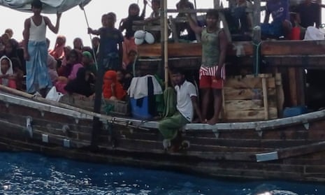 Rohingya refugees stranded on a wooden boat on the water off Indonesia, on their way to Malaysia, in December.