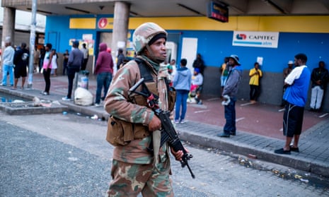 A South African National Defence Force soldier patrols in Hillbrow, Johannesburg