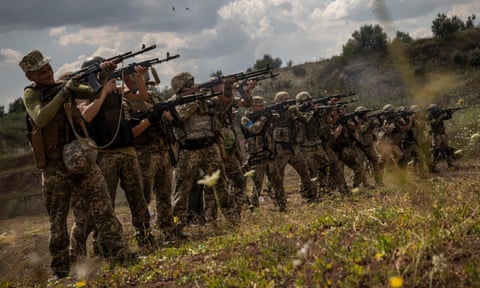 Recruits undertake target practice near the frontline. All photographs: Ed Ram