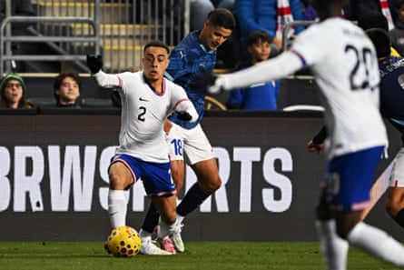 Sergino Dest #2 of United States fights for the ball with Alex Arce #18 of Paraguay at Subaru Park on November 15, 2025 in Chester, Pennsylvania.