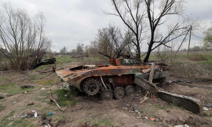 A destroyed Russian APC lies in a field in Rusaniv, outskirts of Kyiv.