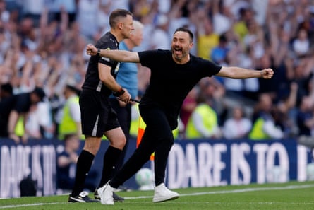 Roberto De Zerbi races on to the pitch after full time.